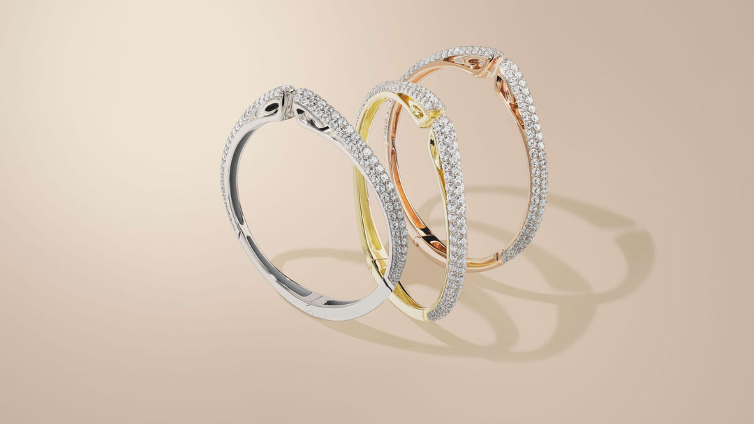 Trio of sparkling cuffs in silver, gold, rose gold from REALM Fine + Fashion Jewelry