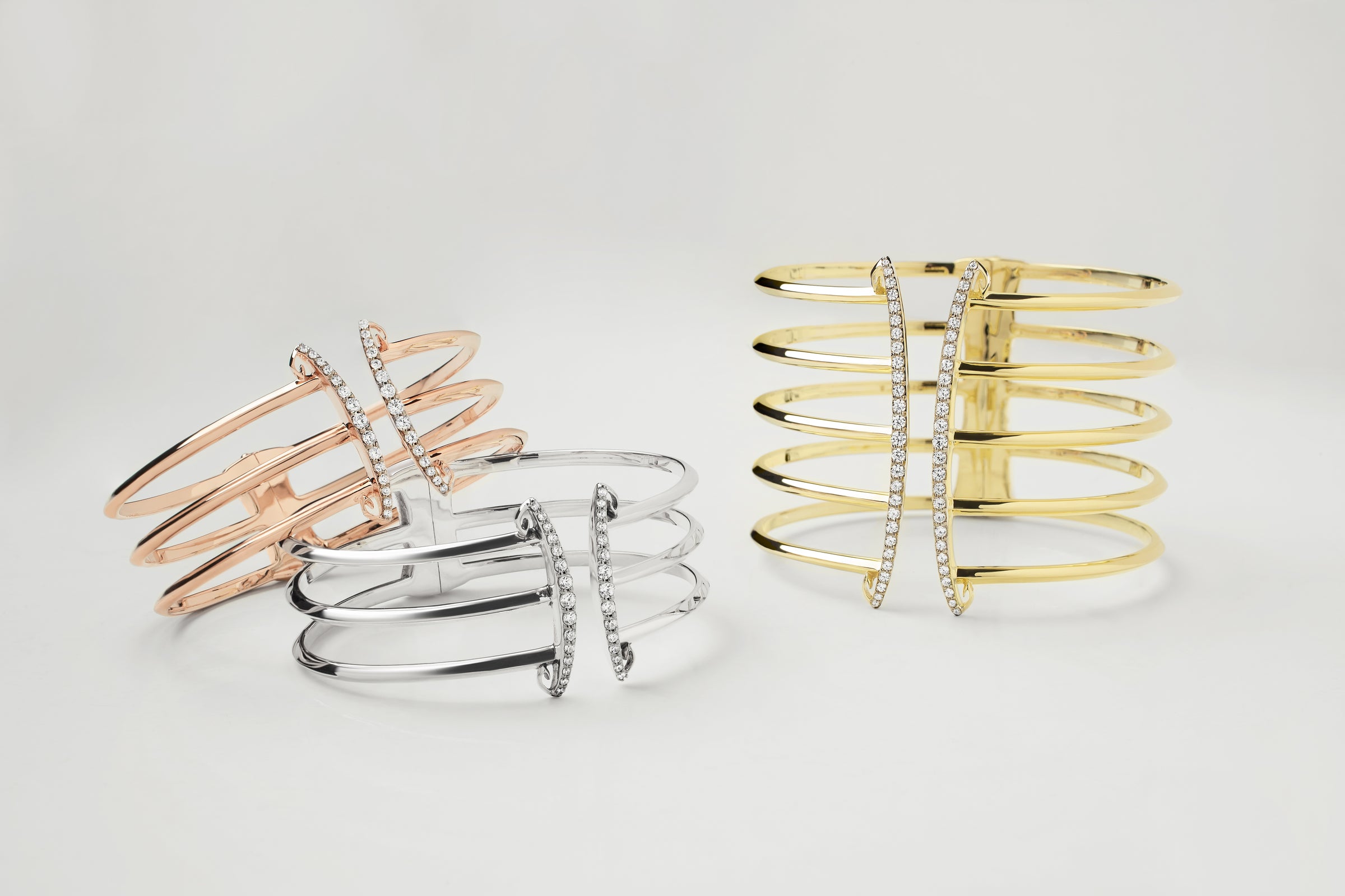 trio of statement corset cuff bracelets in rose gold, silver and gold