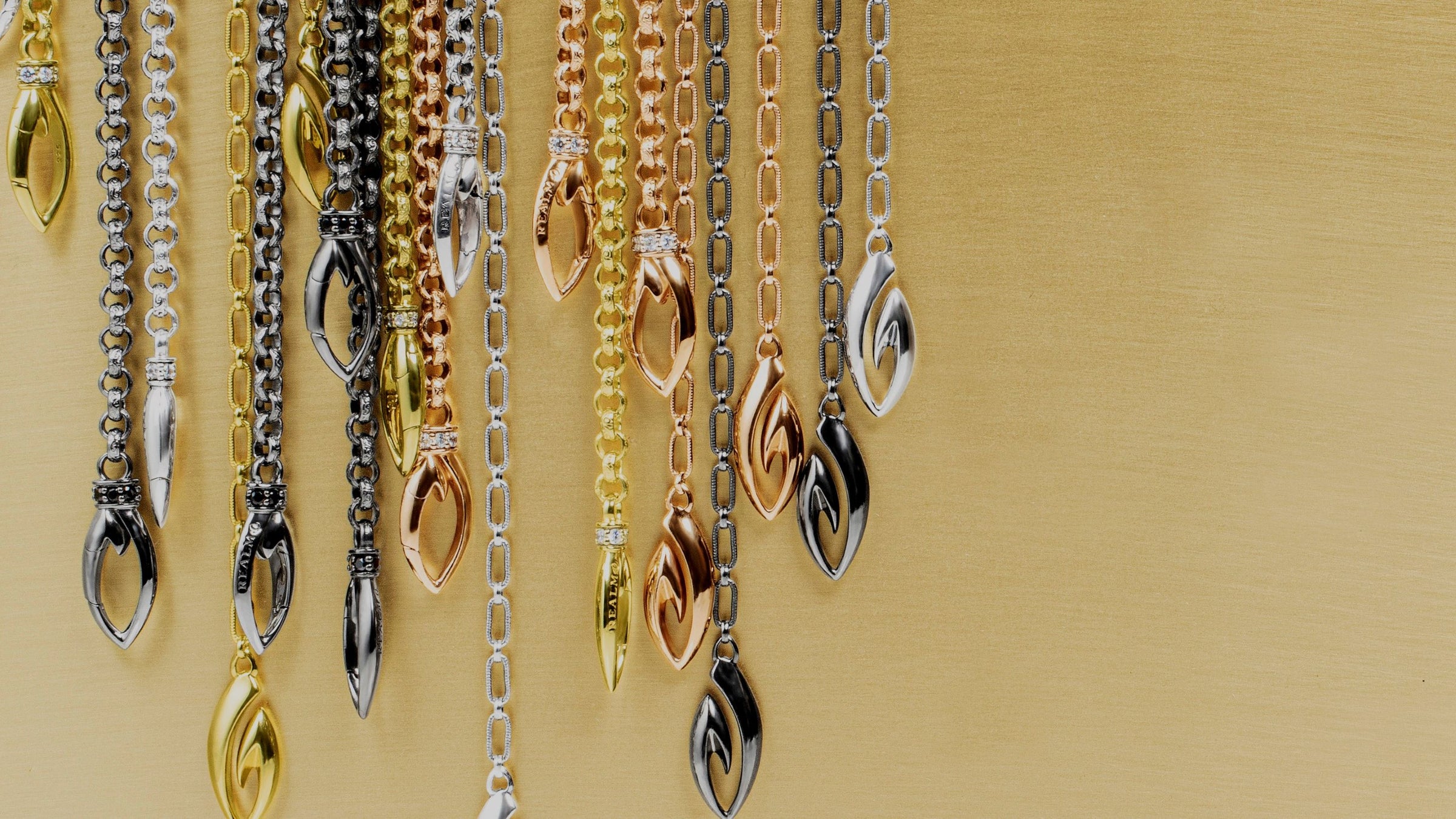 Array of chain necklaces in silver, gold, rose gold and black ruthenium