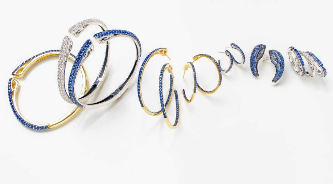 Collection of sapphire-blue-hued CZ Azure cuffs, hoops and stack rings.